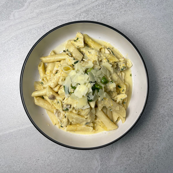 Creamy Chicken Pasta creamy chicken sauce poured over Al Dente pasta and topped with parmesan cheese.